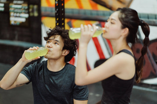 Couple drinking electrolytes