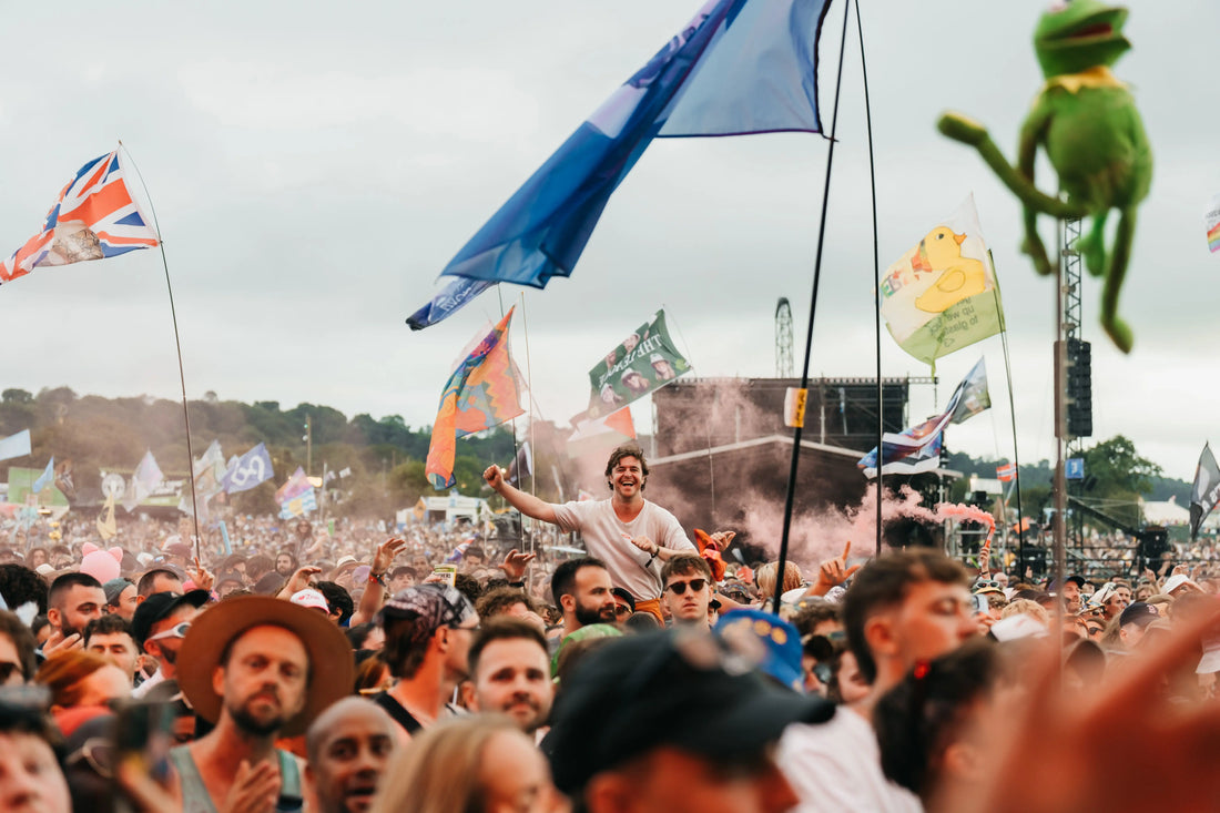 a crowd of people at a festival outside